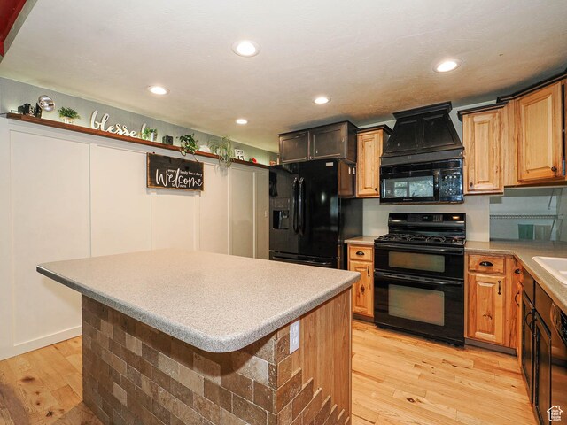 12615 S Dunhammer Dr, Riverton, UT 84065 - kitchen featuring black appliances, light wood finished floors, a center island, light countertops, and recessed lighting
