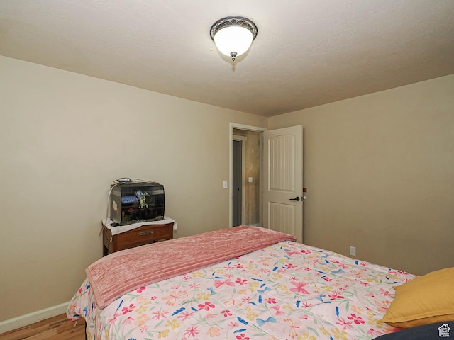 12615 S Dunhammer Dr, Riverton, UT 84065 - bedroom with light wood-style flooring and baseboards