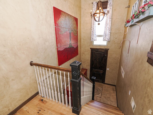12615 S Dunhammer Dr, Riverton, UT 84065 - stairs featuring wood finished floors and a chandelier