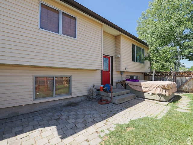 12615 S Dunhammer Dr, Riverton, UT 84065 - rear view of property with a hot tub and a patio area