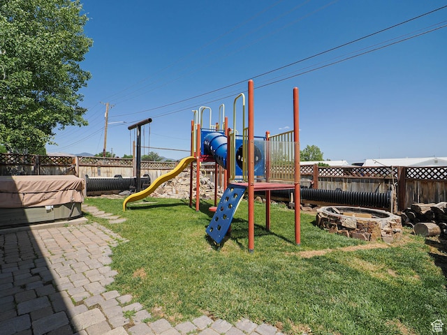 12615 S Dunhammer Dr, Riverton, UT 84065 - view of play area with a hot tub and a fenced backyard