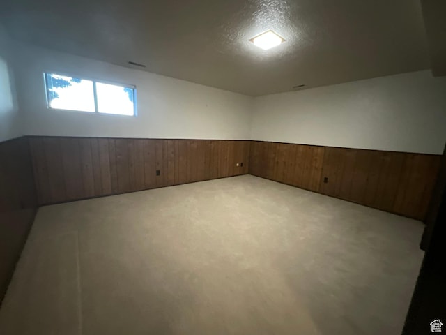 3696 N 475 E, North Ogden, UT 84414 - basement with wainscoting, wooden walls, carpet, and a textured ceiling