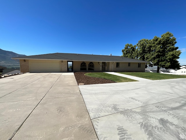 3696 N 475 E, North Ogden, UT 84414 - single story home with driveway, brick siding, an attached garage, and a front lawn