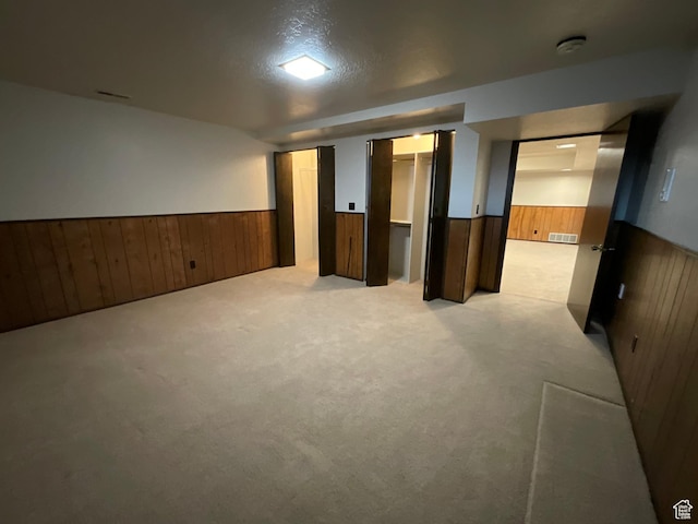 3696 N 475 E, North Ogden, UT 84414 - finished below grade area with wainscoting, wooden walls, and light colored carpet