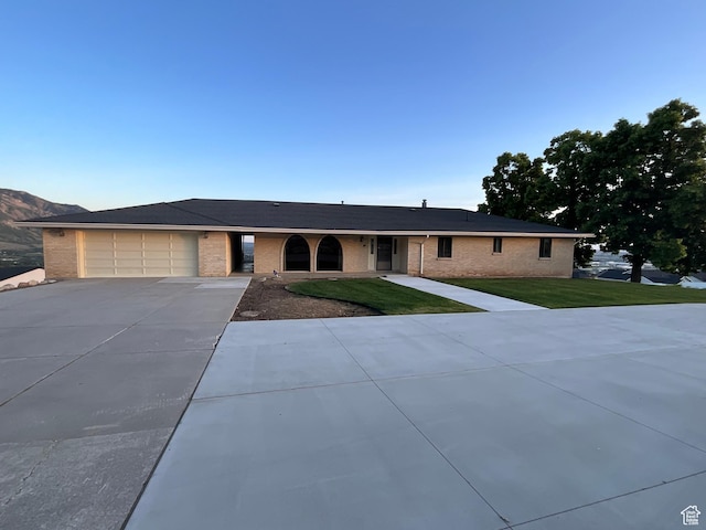 3696 N 475 E, North Ogden, UT 84414 - single story home featuring driveway, brick siding, a front lawn, and a garage
