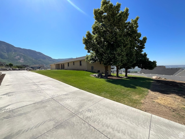 3696 N 475 E, North Ogden, UT 84414 - view of grassy yard featuring driveway and a mountain view