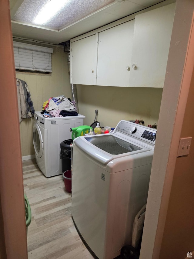 3947 W Ridgeview Way, Taylorsville, UT 84118 - laundry room with cabinet space, independent washer and dryer, and light wood-style floors