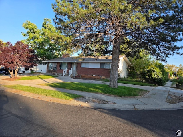 3947 W Ridgeview Way, Taylorsville, UT 84118 - single story home featuring brick siding, driveway, and a chimney