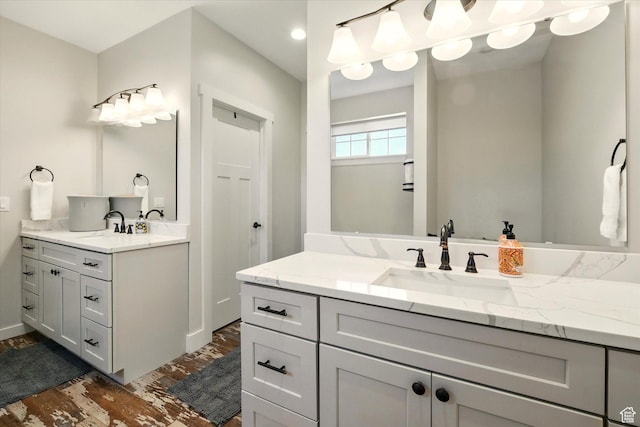 689 W Dee Dr, Garden City, UT 84028 - bathroom with two vanities and wood finished floors