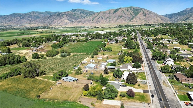 572 W 300 N, Hyrum, UT 84319 - aerial view of property and surrounding area with farmland and a mountainous background