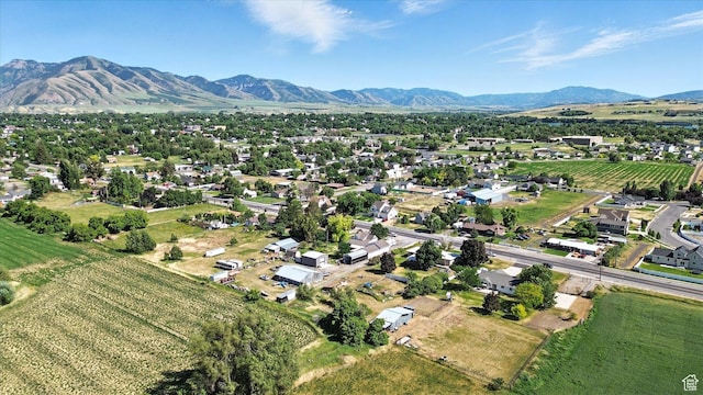 572 W 300 N, Hyrum, UT 84319 - aerial overview of property's location with abundant farmland, a mountainous background, and rural landscape