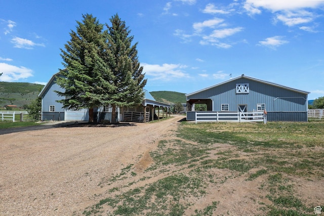 2125 E Elk Meadow Cir, Kamas, UT 84036 - view of property exterior with an outdoor structure, dirt driveway, and an exterior structure
