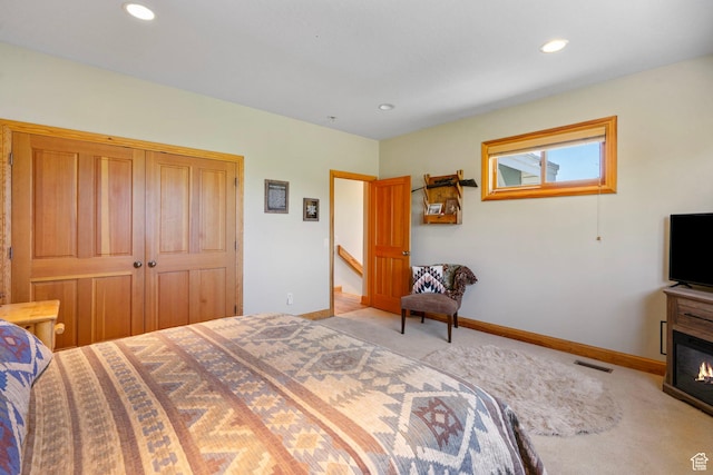 2125 E Elk Meadow Cir, Kamas, UT 84036 - carpeted bedroom with recessed lighting and a glass covered fireplace
