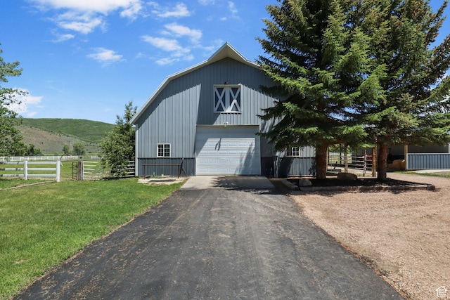 2125 E Elk Meadow Cir, Kamas, UT 84036 - view of front of home with a barn, an outdoor structure, driveway, a garage, and a mountain view