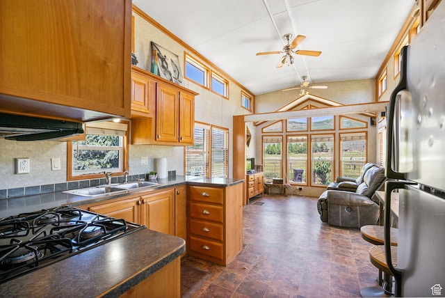 2125 E Elk Meadow Cir, Kamas, UT 84036 - kitchen with freestanding refrigerator, a ceiling fan, dark countertops, plenty of natural light, and high vaulted ceiling