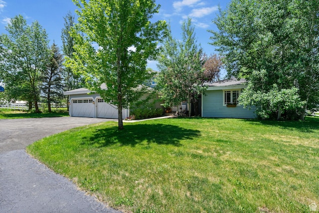 2125 E Elk Meadow Cir, Kamas, UT 84036 - view of front of home featuring a front yard, asphalt driveway, and a garage