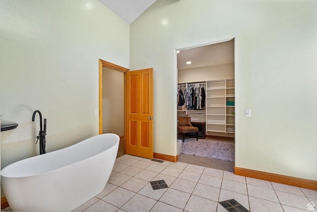 2125 E Elk Meadow Cir, Kamas, UT 84036 - bathroom with a freestanding tub, high vaulted ceiling, tile patterned flooring, and a walk in closet