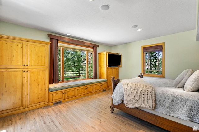 2125 E Elk Meadow Cir, Kamas, UT 84036 - bedroom with multiple windows, light wood-style flooring, and recessed lighting