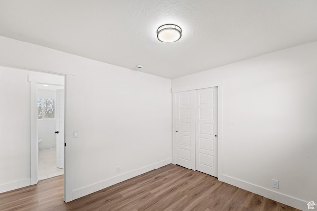 10 S 1400 E, Pleasant Grove, UT 84062 - unfurnished bedroom with light wood finished floors and a closet