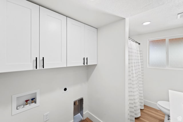 10 S 1400 E, Pleasant Grove, UT 84062 - washroom featuring wood finished floors, electric dryer hookup, cabinet space, washer hookup, and a textured ceiling