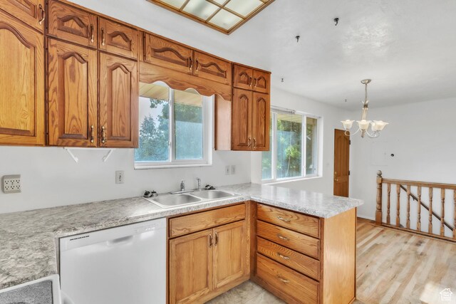 185 S 200 W, Providence, UT 84332 - kitchen featuring white dishwasher, a peninsula, light countertops, and plenty of natural light