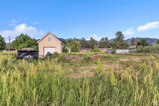 185 S 200 W, Providence, UT 84332 - view of yard featuring a mountain view and a garage