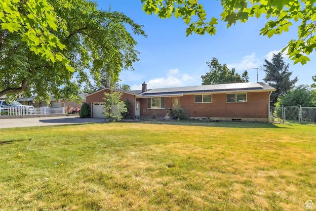 185 S 200 W, Providence, UT 84332 - single story home with a garage, concrete driveway, solar panels, a chimney, and a gate