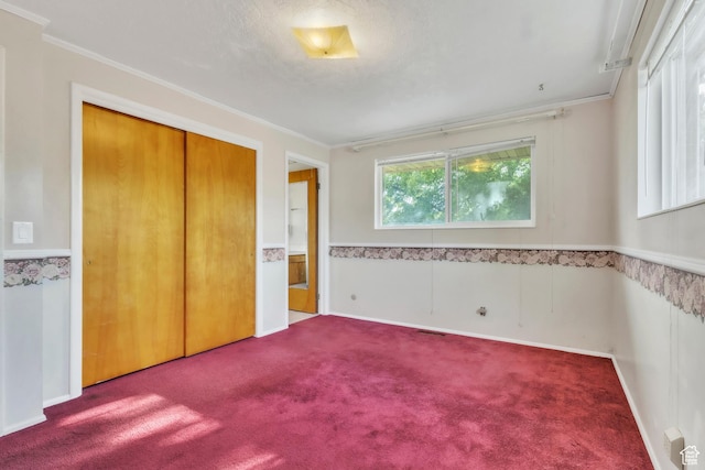 185 S 200 W, Providence, UT 84332 - unfurnished bedroom with carpet flooring, crown molding, and a closet