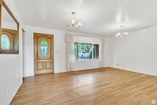 185 S 200 W, Providence, UT 84332 - foyer with a chandelier and light wood finished floors