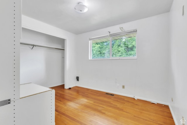 185 S 200 W, Providence, UT 84332 - unfurnished bedroom featuring light wood-style floors and a closet