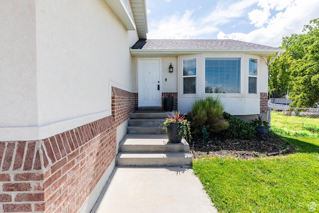14048 S Van Cott Peak Cir W, Riverton, UT 84096 - doorway to property featuring brick siding and roof with shingles