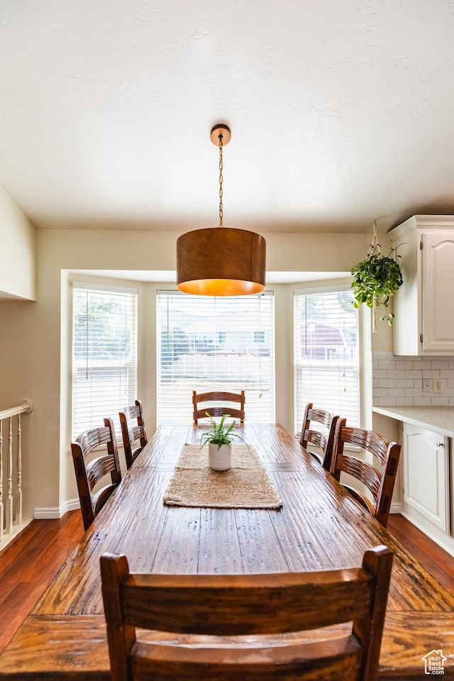 14048 S Van Cott Peak Cir W, Riverton, UT 84096 - dining space featuring dark wood finished floors and healthy amount of natural light