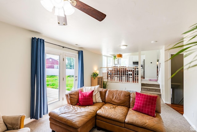 14048 S Van Cott Peak Cir W, Riverton, UT 84096 - living room with light carpet, ceiling fan, and stairway