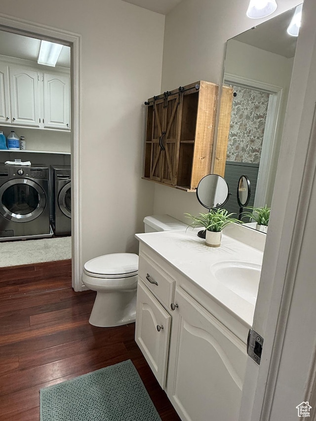 14048 S Van Cott Peak Cir W, Riverton, UT 84096 - bathroom featuring independent washer and dryer, double vanity, and wood finished floors