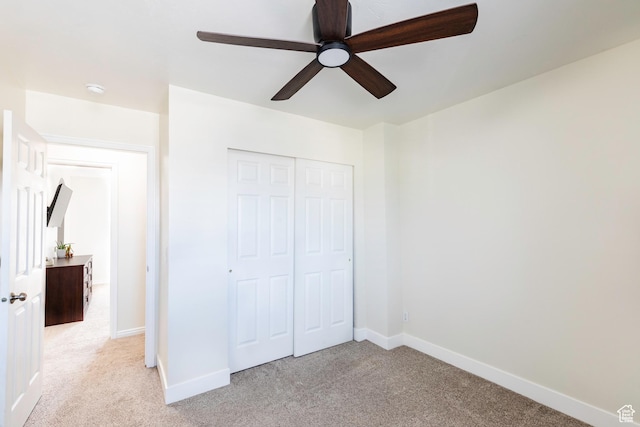 14048 S Van Cott Peak Cir W, Riverton, UT 84096 - unfurnished bedroom featuring light carpet, a closet, and ceiling fan