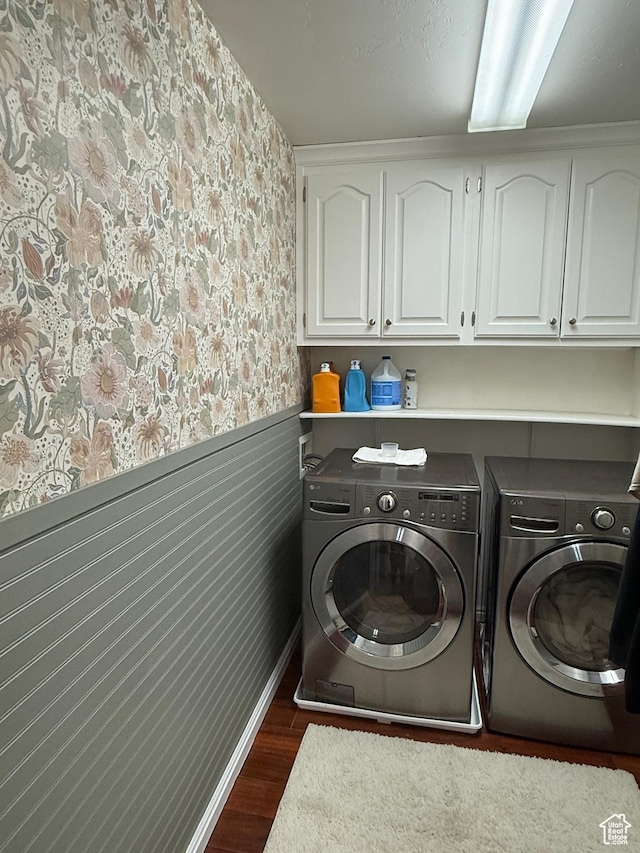 14048 S Van Cott Peak Cir W, Riverton, UT 84096 - laundry room featuring cabinet space, washing machine and clothes dryer, wallpapered walls, dark wood-style floors, and a wainscoted wall