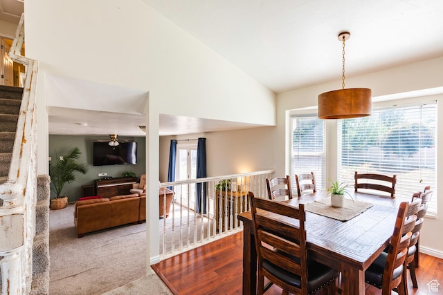 14048 S Van Cott Peak Cir W, Riverton, UT 84096 - dining room featuring plenty of natural light, stairs, wood finished floors, high vaulted ceiling, and carpet floors