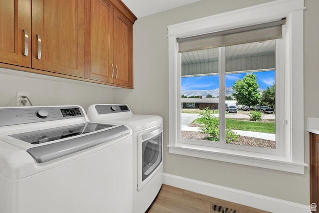 6699 E 950 S, Huntsville, UT 84317 - washroom with cabinet space, washing machine and dryer, and light wood finished floors