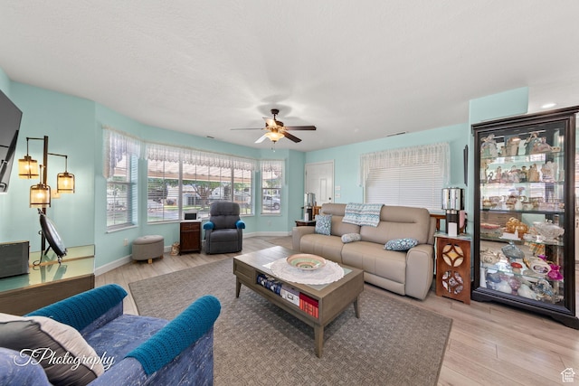 180 N 1100 E Unit 190, Washington, UT 84780 - living area with light wood finished floors and ceiling fan