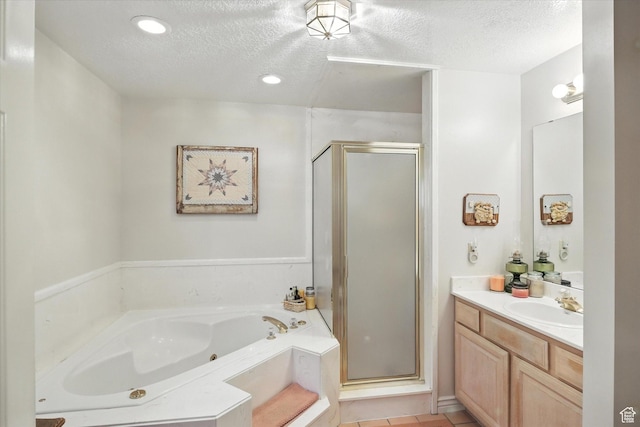 36 N Main St, Mantua, UT 84324 - full bath with a shower stall, vanity, a textured ceiling, a jetted tub, and recessed lighting