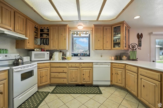 36 N Main St, Mantua, UT 84324 - kitchen featuring white appliances, under cabinet range hood, backsplash, light tile patterned floors, and a textured ceiling