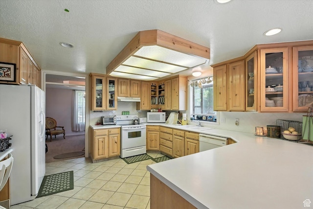 36 N Main St, Mantua, UT 84324 - kitchen with white appliances, light countertops, light tile patterned flooring, recessed lighting, and glass insert cabinets