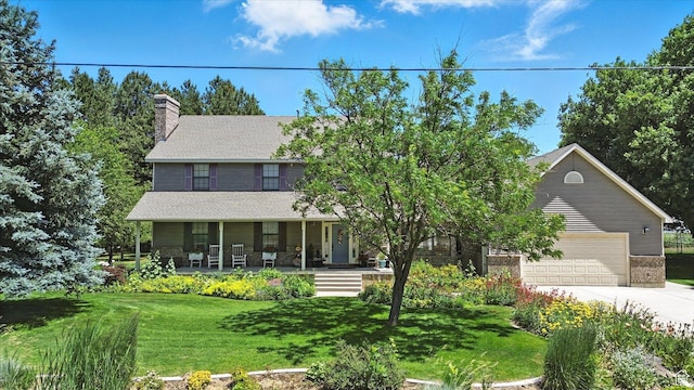 36 N Main St, Mantua, UT 84324 - view of front of property featuring a porch, a front lawn, driveway, and a chimney
