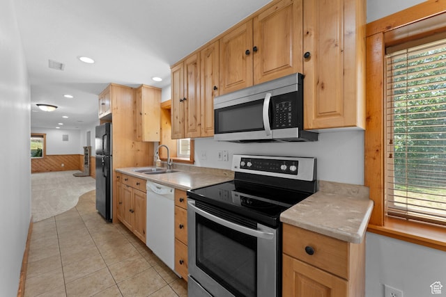 1060 E 1100 N, Pleasant Grove, UT 84062 - kitchen featuring appliances with stainless steel finishes, recessed lighting, light countertops, light tile patterned flooring, and light brown cabinets