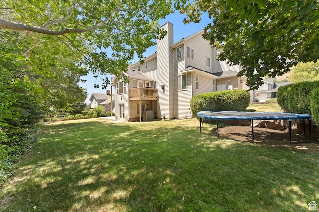 1060 E 1100 N, Pleasant Grove, UT 84062 - view of grassy yard with a trampoline and a wooden deck