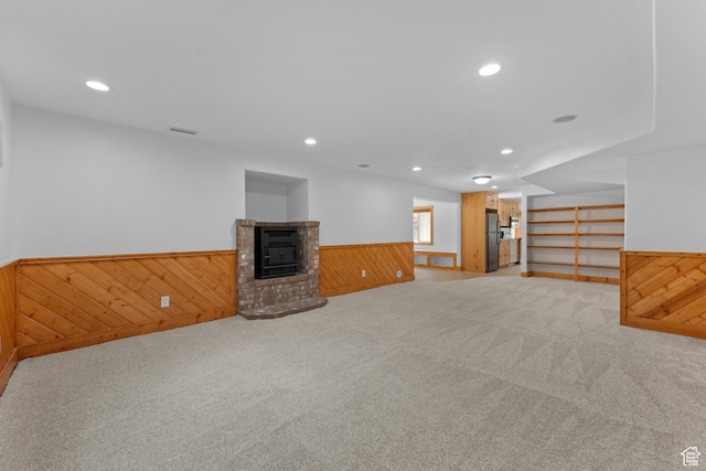 1060 E 1100 N, Pleasant Grove, UT 84062 - basement featuring freestanding refrigerator, a wainscoted wall, wooden walls, carpet floors, and a brick fireplace