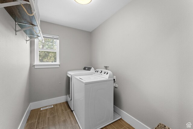 1060 E 1100 N, Pleasant Grove, UT 84062 - laundry area with washer and clothes dryer and wood finished floors