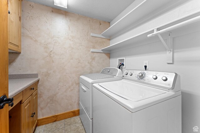 1060 E 1100 N, Pleasant Grove, UT 84062 - washroom with washing machine and clothes dryer, cabinet space, and light tile patterned floors