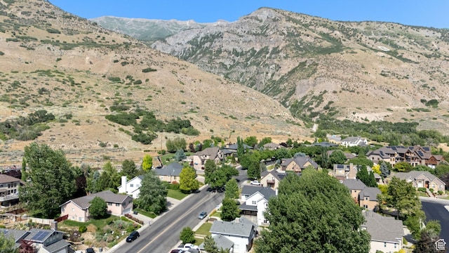 1060 E 1100 N, Pleasant Grove, UT 84062 - aerial overview of property's location with nearby suburban area and a mountain backdrop