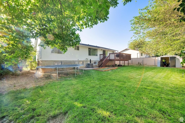 45 W 900 S, Layton, UT 84041 - rear view of property with a trampoline, a storage shed, a deck, and a fenced backyard